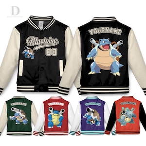 May include: Varsity-style jacket with black body, cream sleeves, and striped trim. Features "Blastoise 08" text and a Blastoise graphic on the front. Additional jackets in green, red, purple, and black with personalized text and Blastoise graphics on the back.