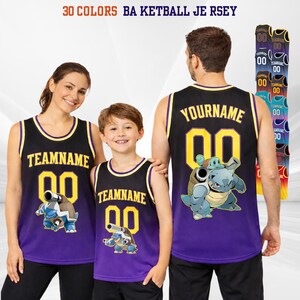 May include: Black and purple basketball jersey with yellow accents. The jersey features a cartoon character graphic and the text "TEAMNAME" and "YOURNAME" with the number "00". The image also shows a variety of color options.
