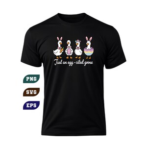 May include: Black t-shirt featuring a whimsical design of four cartoon geese dressed for Easter. The geese are wearing bunny ears and holding Easter eggs and a carrot. The text "Just an egg-cited goose" is written below the geese.