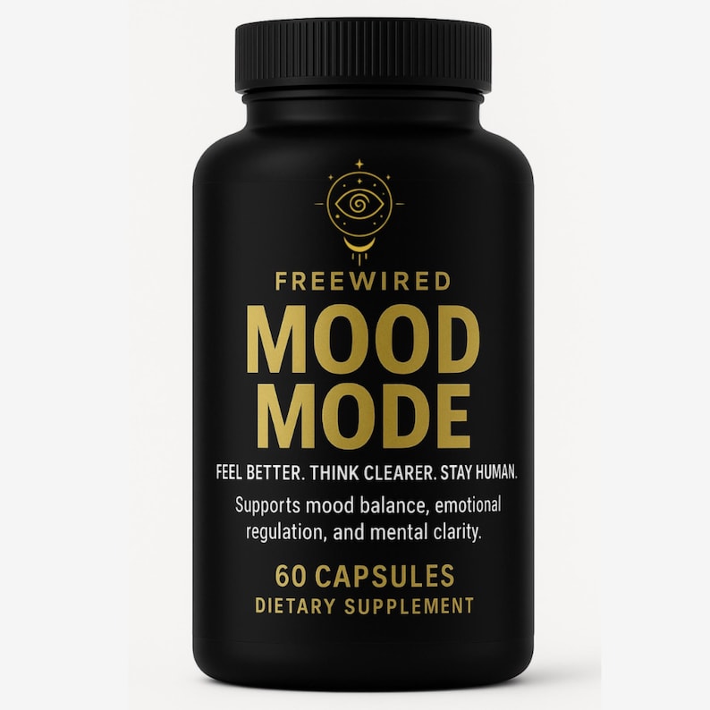 May include: A black supplement bottle with a black cap. The bottle has gold text that reads "FREEWIRED MOOD MODE" and "60 CAPSULES DIETARY SUPPLEMENT". The bottle also states "FEEL BETTER. THINK CLEARER. STAY HUMAN."