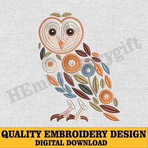 May include: An embroidered owl design with a heart-shaped head, brown eyes, and a beige beak. The owl's body is composed of floral and leaf elements in shades of orange, blue, and brown. The text "QUALITY EMBROIDERY DESIGN DIGITAL DOWNLOAD" is at the bottom.