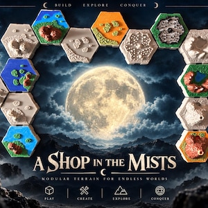 May include: A collection of hexagonal modular terrain tiles featuring varied landscapes like mountains, forests, and water. The tiles are arranged in a horseshoe shape around a central moon graphic with the text A SHOP IN THE MISTS.