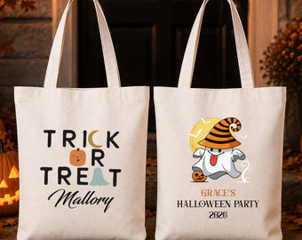 May include: Two off-white canvas tote bags. The left bag features the text "TRICK OR TREAT" with a pumpkin and ghost icon, and the name "Mallory". The right bag shows a ghost wearing a striped hat, with the text "GRACE'S HALLOWEEN PARTY 2026".