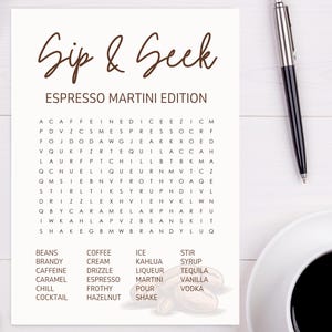 May include: A white paper with the text "Sip & Seek Espresso Martini Edition" and a word search puzzle. A black pen and a cup of coffee are on the right. The word list includes "espresso" and "martini".