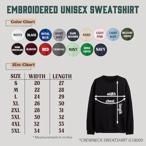 May include: An embroidered unisex sweatshirt color and size chart featuring a black crewneck sweatshirt with width and length measurement arrows. The chart lists sizes S through 5XL with corresponding measurements in inches for the G18000 model.