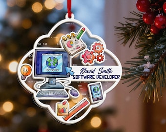 May include: A clear, cloud-shaped Christmas ornament with a red ribbon. The ornament features a computer, gears, and a tablet, with the text "David Smith SOFTWARE DEVELOPER". The design includes a lightbulb, a notepad, and a ruler.