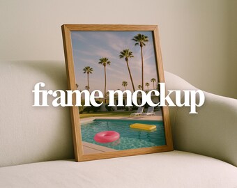 May include: A framed image featuring a pool scene with palm trees, a pink inflatable ring, and a yellow inflatable raft. The frame is made of light-colored wood. The text "frame mockup" is displayed across the image.