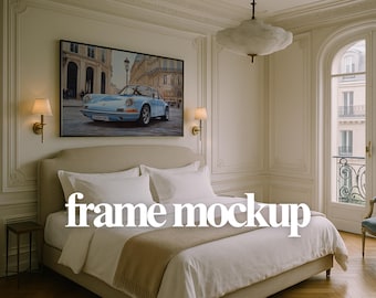May include: A bedroom interior with a bed dressed in white bedding and a beige throw. A framed artwork of a light blue vintage car hangs above the bed. The text "frame mockup" is overlaid on the bed.