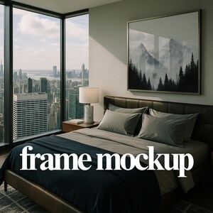 May include: A bedroom with a large window overlooking a cityscape, including the Empire State Building. The room features a bed with gray bedding, a framed mountain landscape art piece, and a bedside lamp. The text "frame mockup" is overlaid on the bed.