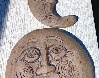 Lady full moon and a crescent Moon to go with it, beautiful swirls. stoneware fired to hang outside winter or summer happy smiling faces