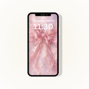 May include: A smartphone shows a pink bow wallpaper with the text "Thursday, Jan 30" and "11:30" in white. The phone has a black bezel and a white background.