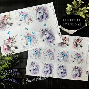 May include: Two sheets of printable transfer paper featuring watercolor illustrations of unicorns with floral crowns and butterflies. The paper is labeled "J Bonus Art Studios" and "Printable Transfer Paper".