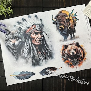 May include: A sheet of transfer paper with five images: a Native American chief, a wolf, a buffalo, a bear, and two feathers. The images are in black, white, and shades of gray. The paper has the text "Bonus Art Studios Deco" in the bottom right corner.