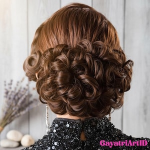 May include: A woman's hairstyle featuring voluminous, dark brown curls. The hair is styled in an updo, with the curls cascading around the back of the head. The woman is wearing a black sequined top. The background is a light gray wooden wall.