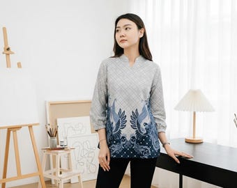 May include: A grey blouse with a geometric pattern and three-quarter sleeves. The bottom of the blouse features a blue and navy bird design. The text "GayatriArtID" is visible in the bottom right corner.