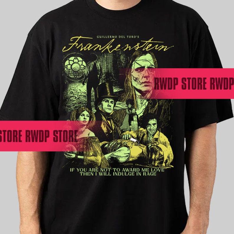May include: Black t-shirt featuring a graphic from Guillermo del Toro's "Frankenstein." The design includes a collage of characters and the film's title in a stylized font. The quote "IF YOU ARE NOT TO AWARD ME LOVE THEN I WILL INDULGE IN RAGE" is also printed.