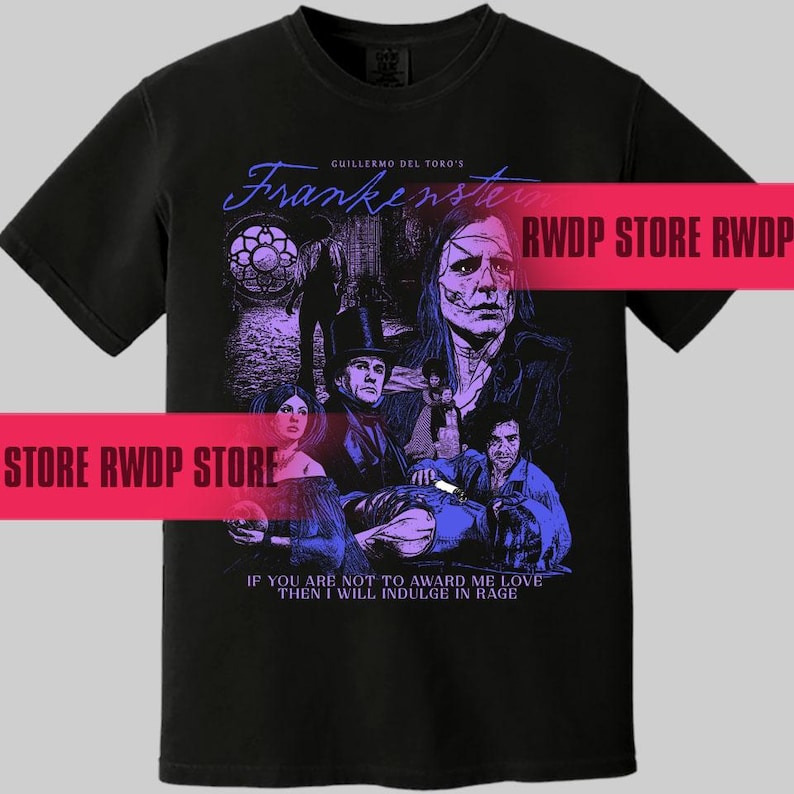 May include: Black t-shirt featuring a graphic from Guillermo del Toro's "Frankenstein." The design includes characters and the film's title in a stylized font. The quote "IF YOU ARE NOT TO AWARD ME LOVE THEN I WILL INDULGE IN RAGE" is also present.