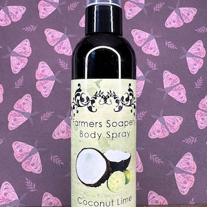 May include: A black bottle with a clear spray nozzle and a white label. The label says "Farmers Soapery Body Spray" and "Coconut Lime" with a picture of a coconut and limes. The bottle is 4 oz.