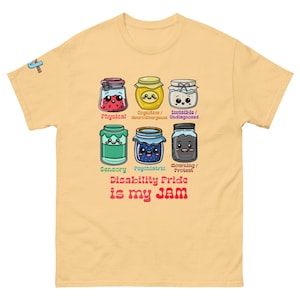 May include: A light yellow t-shirt with a graphic featuring six cartoon jars, each representing a different type of disability. Text on the shirt reads "Disability Pride is my JAM."