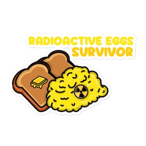 May include: A sticker featuring a cartoon illustration of two slices of toast with butter and a pile of scrambled eggs with a radiation symbol. The text "RADIOACTIVE EGGS SURVIVOR" is in yellow.