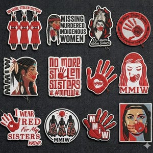 May include: A collection of embroidered patches with red and white designs. The patches feature text such as "No More Stolen Sisters," "Missing Murdered Indigenous Women," and "I Wear Red For My Sisters." Some patches depict hands, faces, and figures.