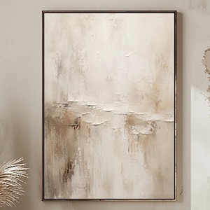 May include: A rectangular framed wall art piece featuring an abstract painting with textured brushstrokes in shades of beige, cream, and soft brown, displayed in a vertical orientation with a thin dark frame surrounding the canvas.