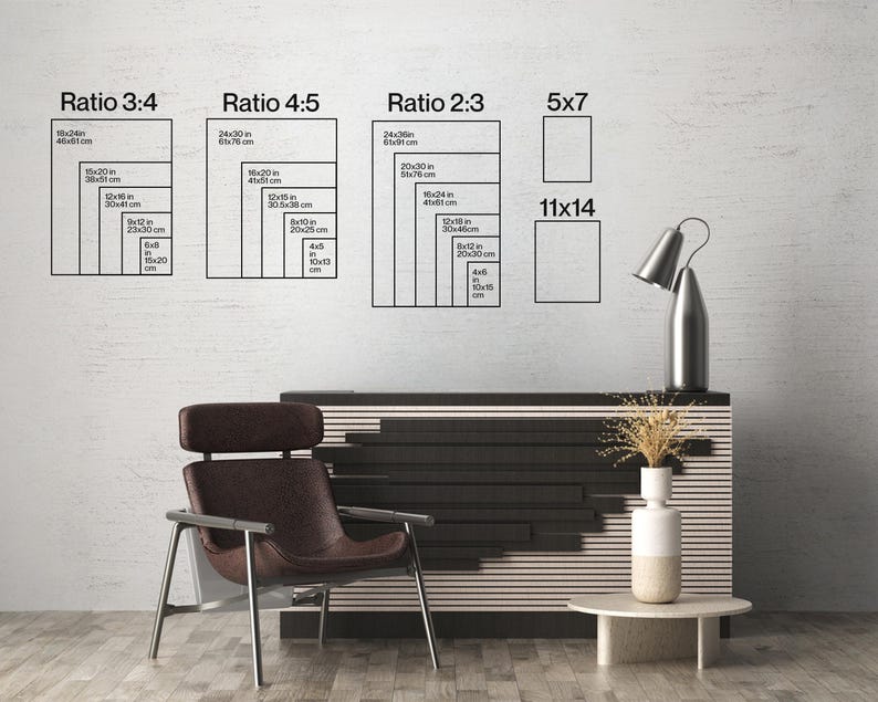 May include: A room interior with a modern design. The image features a dark brown chair, a black and white cabinet, and a small round table. On the wall are diagrams showing different aspect ratios for prints, including 5x7 and 11x14 inch sizes.