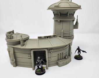 May include: A gray, 3D printed model of a futuristic building with a rounded, curved section and a tower. Two miniature figures stand in front of the building.