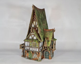 May include: A miniature model of a two-story house with a steeply pitched roof covered in green moss. The house has a wooden frame and stone foundation, with windows and a door. The house is painted in shades of brown, green, and white.