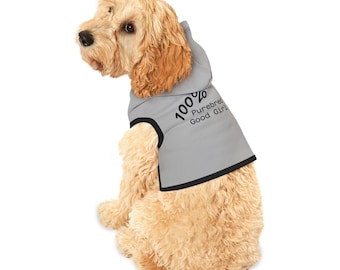May include: A light gray dog hoodie with black trim, featuring the text "100% Purebred Good Girl". The dog is a light brown color and is sitting down.