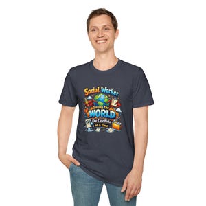 May include: Navy blue t-shirt with a colorful graphic. The graphic reads "Social Worker Saving the World One Case Note at a Time" with a globe, rocket, and other illustrations. The shirt is made of a soft material.
