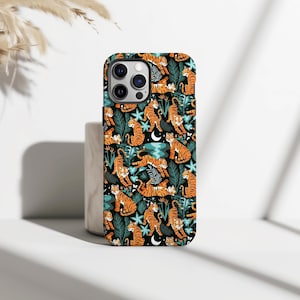 May include: A phone case with a repeating pattern of orange tigers, teal flowers, and green leaves on a black background. The case has a glossy finish and a protective design. The case is designed for a smartphone.