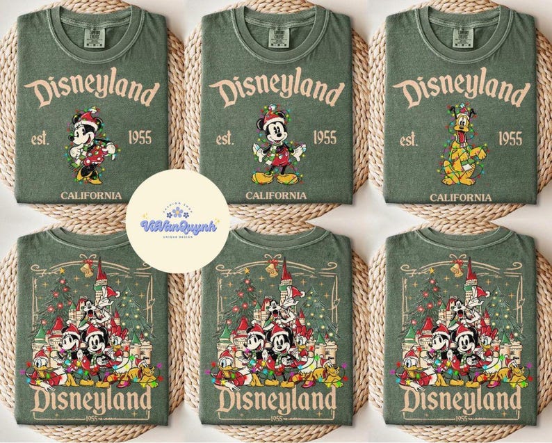 May include: Green t-shirts with Disneyland graphics. The shirts feature Mickey Mouse, Minnie Mouse, and Pluto in festive designs. The text "Disneyland" and "California" are also visible.