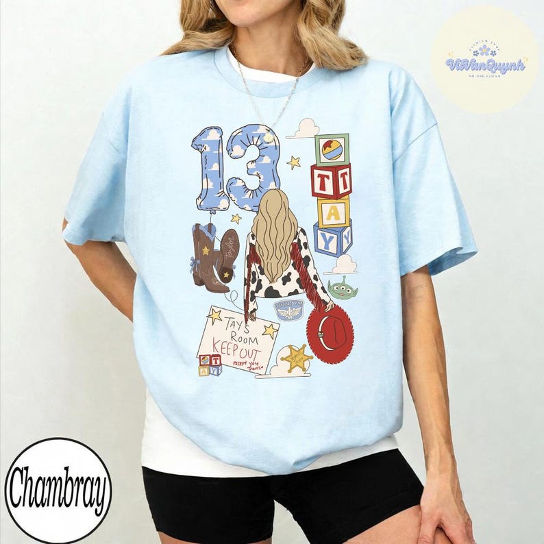 May include: A light blue t-shirt featuring a graphic print with the number 13, a person with long blonde hair wearing a cow-print jacket, brown cowboy boots, a red hat, colorful alphabet blocks, and a sign that reads Tay's Room Keep Out.