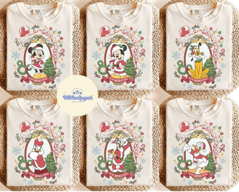May include: Cream-colored t-shirts with Christmas-themed Disney character graphics. Each shirt features a different character, including Mickey, Minnie, Pluto, Donald, and Goofy, in festive attire, surrounded by Christmas decorations and the year 2025.