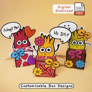 Pode incluir: Download digital colorido com três designs de caixas de desenhos animados com personagens expressivos. Cada caixa tem um design único, incluindo balões de fala com texto. A imagem inclui o texto "Digital Download" e "Customizable Box Designs."