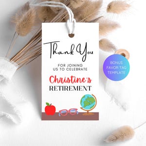 May include: White thank you tag with black text that says "Thank You for joining us to celebrate Christine's Retirement". The tag has a red apple, blue glasses, and a globe on a brown desk.