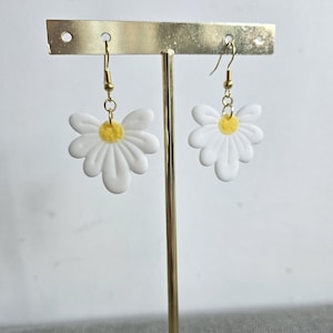 white and yellow flower earrings