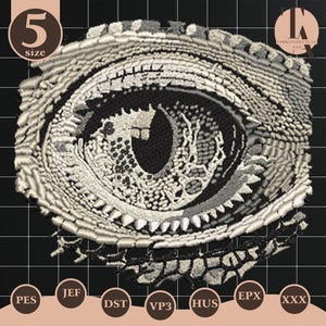 May include: Detailed embroidery design of a reptile eye, featuring intricate stitching in shades of gray and black. The eye has a dark pupil and a textured iris, surrounded by a scaly, textured eyelid. The design includes the number "5" and various file format labels.