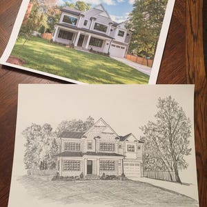 May include: A black and white pencil drawing of a two-story house with a garage. The house has a front porch and a large yard with trees.