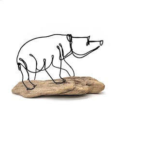 Bear Cub Wire Sculpture: Minimalist Steel Art on Driftwood