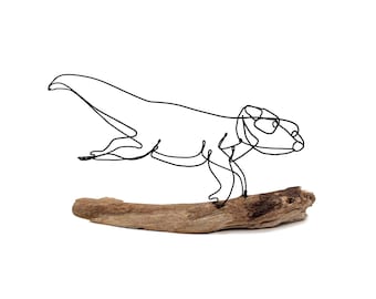 Sculpture artisanale en fil de fer de loutre, dessin en un trait sur bois
