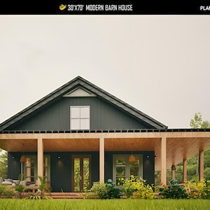 May include: A modern barn house design with a dark gray exterior, a black roof, and a wooden porch. The house has a gabled roof and a covered porch supported by wooden beams. The text "30'x70' MODERN BARN HOUSE" is at the top.