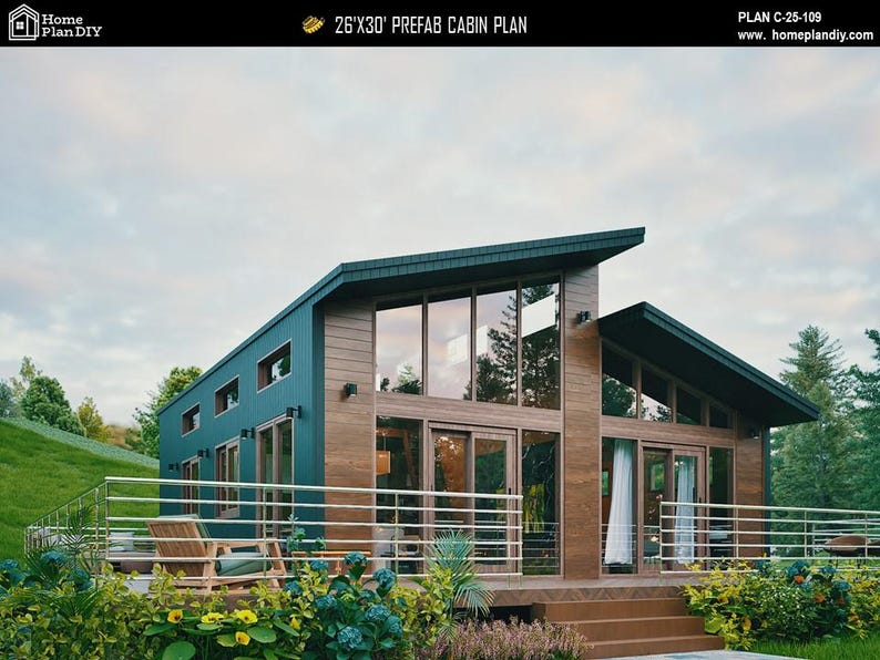 May include: A 26'x30' prefab cabin plan labeled C-25-109. The structure features a dark teal metal exterior, wood-paneled accents, and large floor-to-ceiling windows. A metal railing surrounds the front deck, which includes a wooden chair.