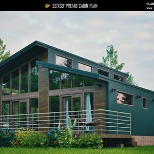May include: A 26'x30' prefab cabin plan featuring a dark green exterior with wood accents, a shed roof, and large glass windows. The structure includes a front deck with a metal railing, and the text 'PLAN C-25-109' is visible at the top.