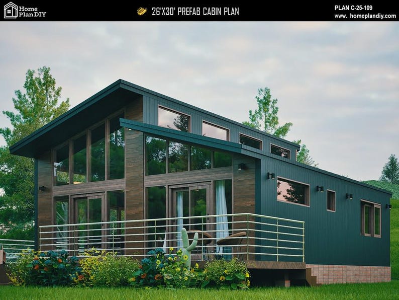 May include: A 26'x30' prefab cabin plan featuring a dark green exterior with wood accents, a shed roof, and large glass windows. The structure includes a front deck with a metal railing, and the text 'PLAN C-25-109' is visible at the top.