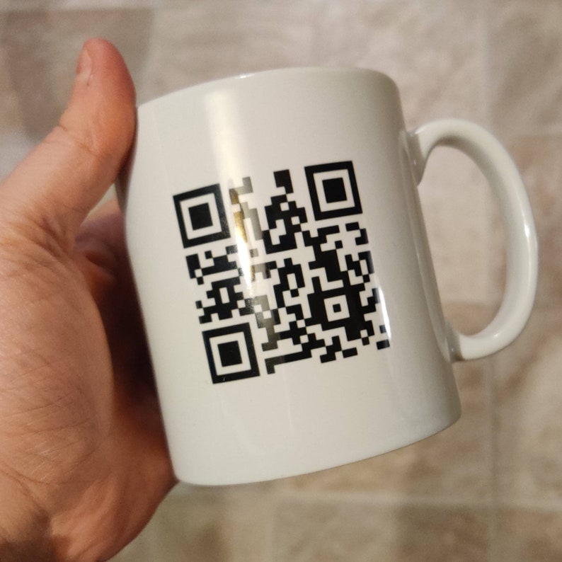 Mystery QR Code Mug. Silly Humour. Juvenile. Puerile. Childish. Rickroll. Meme. Troll. Internet. Rick Astley. Never Gonna Give You Up. QR code (youtube)