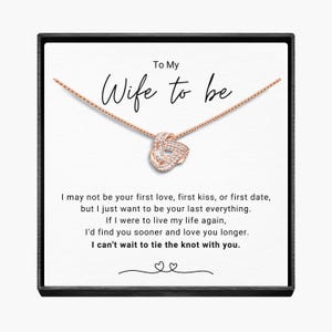 May include: A white card with a rose gold necklace in a black box. The card reads "To My Wife to be" and includes a message about love and marriage.