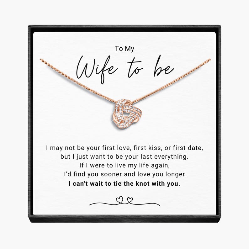 May include: A white card with a rose gold necklace in a black box. The card reads "To My Wife to be" and includes a message about love and marriage.