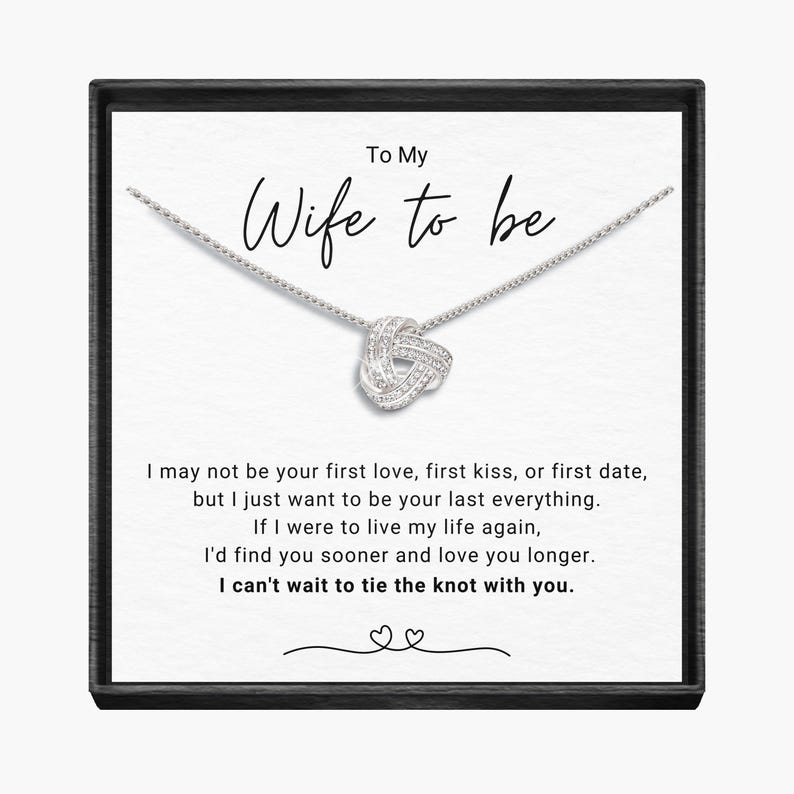 May include: A silver necklace with a knot pendant and a card that reads "To My Wife to be" with a message about love and marriage.
